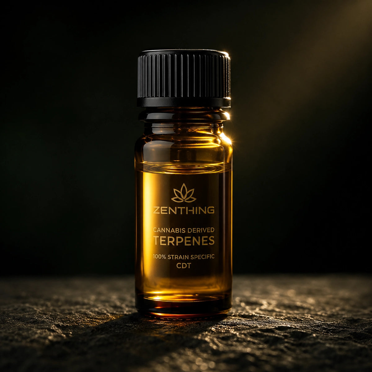 Amber vial of Zenthing cannabis-derived terpenes on dark stone